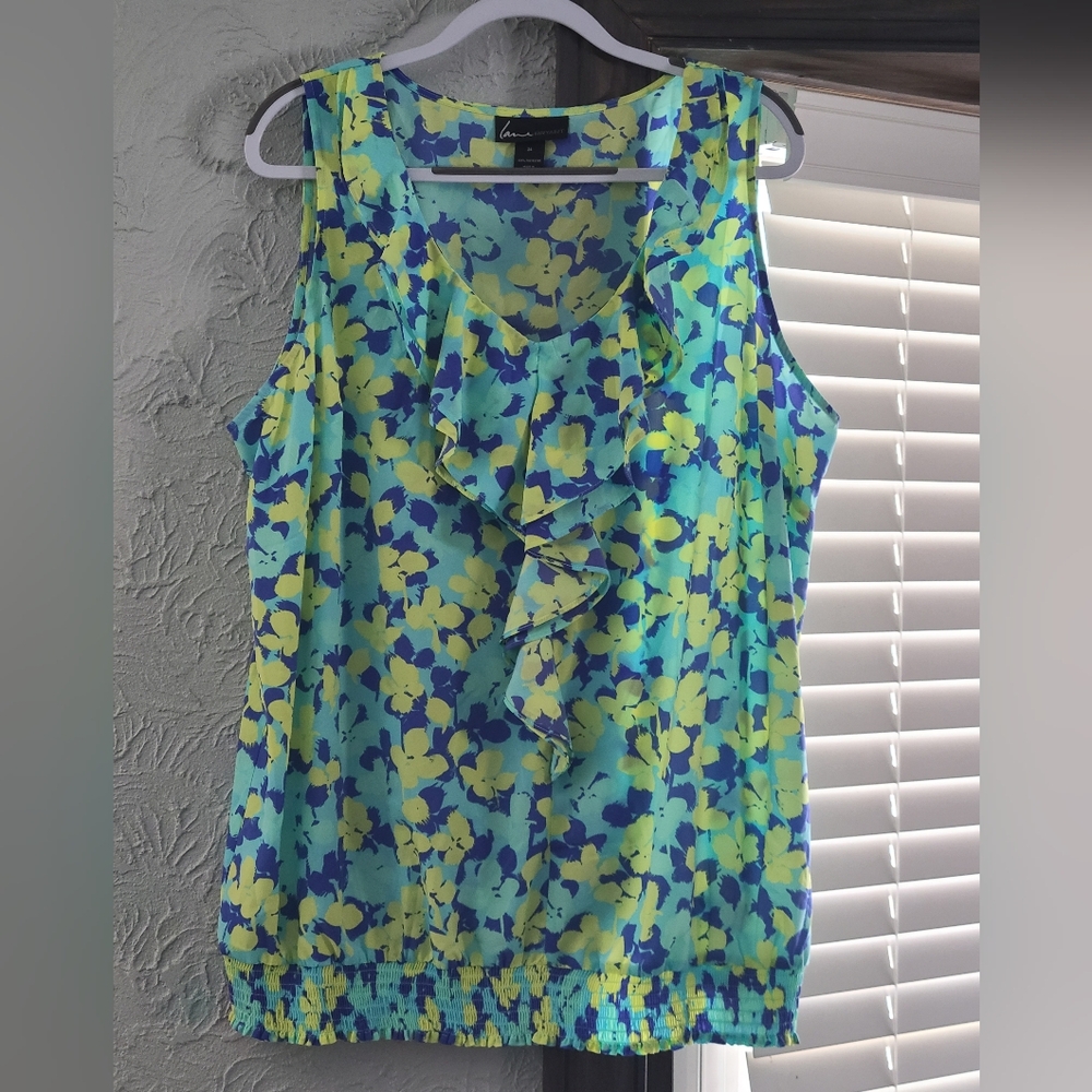 Lane Bryant Sleeveless blouse with a blue and yellow floral print, ruffle detail